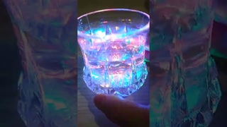 Overview of a glass of water sparkling with bright colors